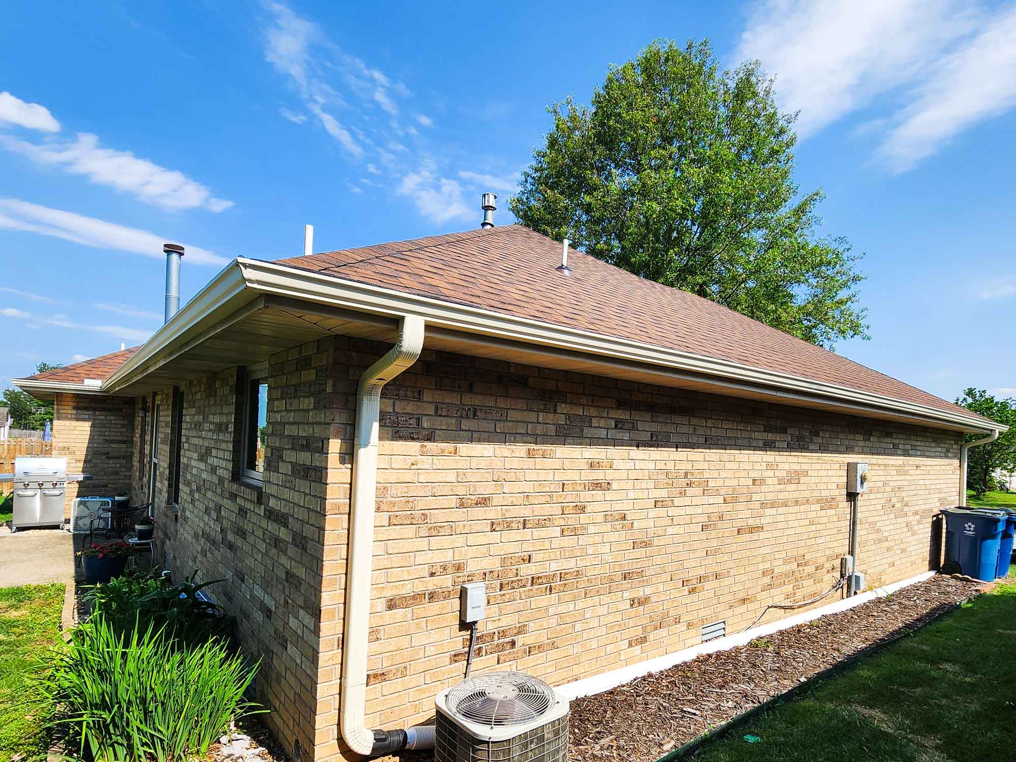 Image of home, specifically showcasing gutter work