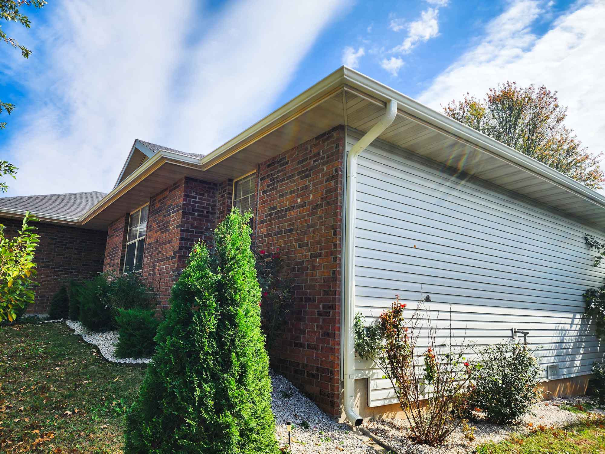 Image of home, specifically showcasing gutter work