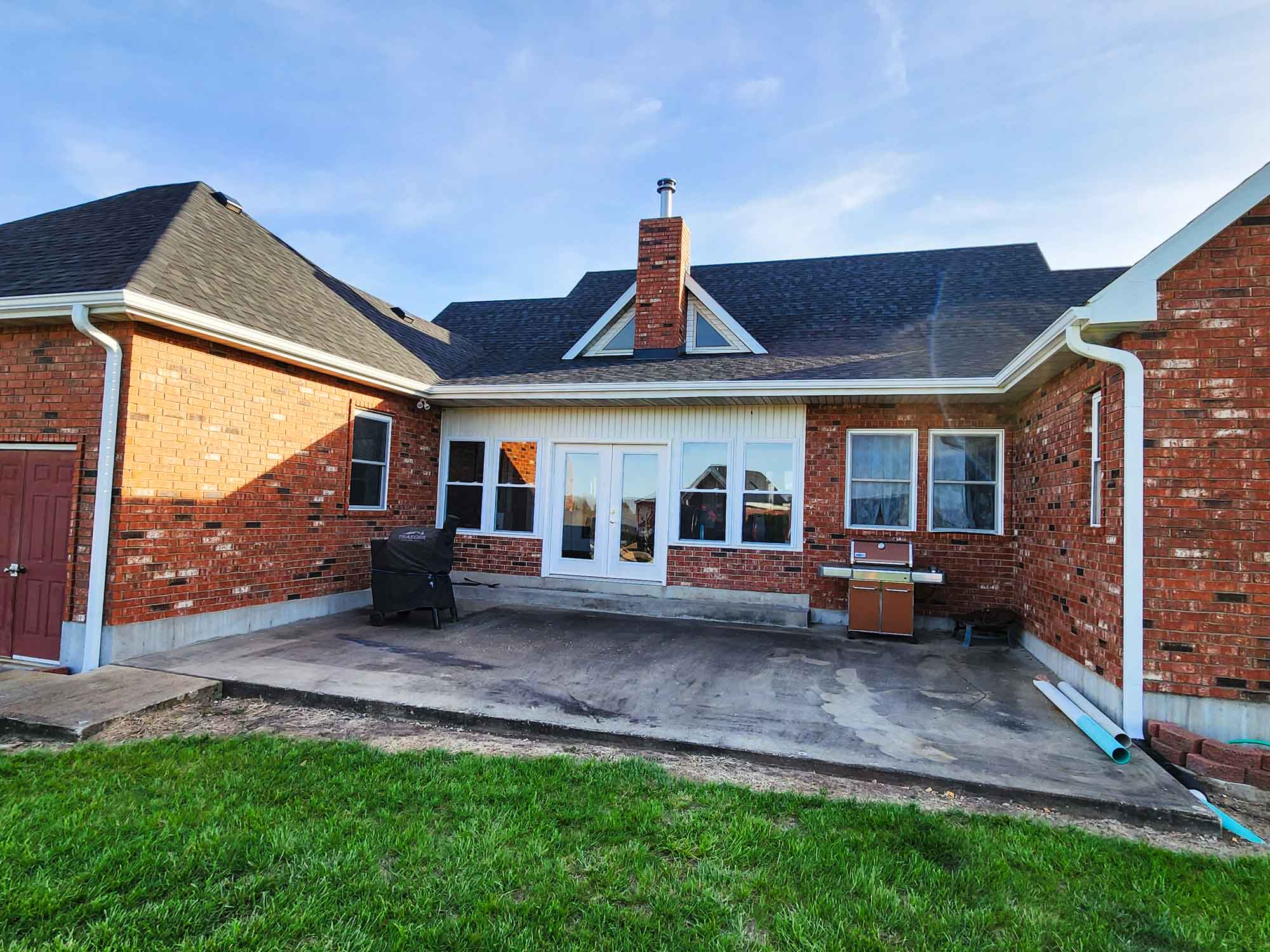 Image of home, specifically showcasing gutter work